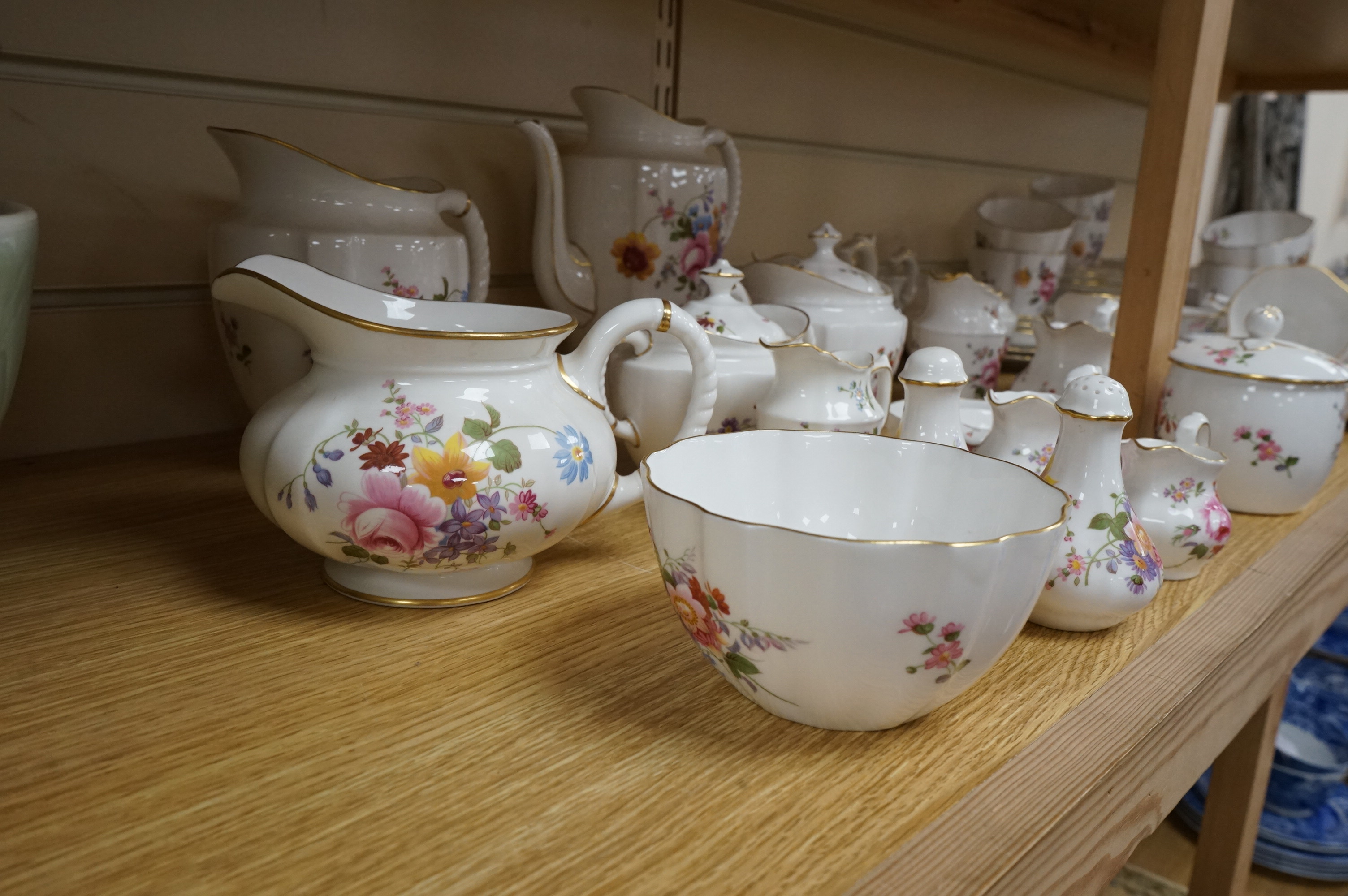 An extensive Crown Derby Posies pattern service to include trios, teapot, jugs and miniatures